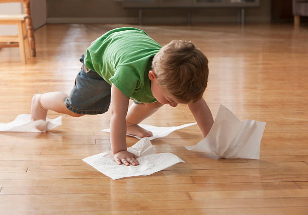 Kid playing on hardwood floor | Carpet Mart