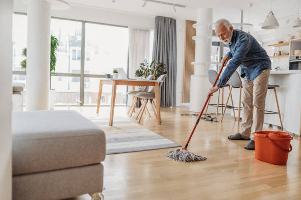 Man cleaning flooring | Carpet Mart